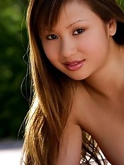Tia Tanaka pops her sexy Asian body out of a bikini